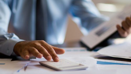 Accountant at desk working.
