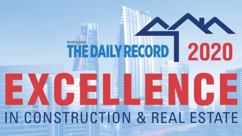 The Daily Record Excellence in Construction & Real Estate award logo.