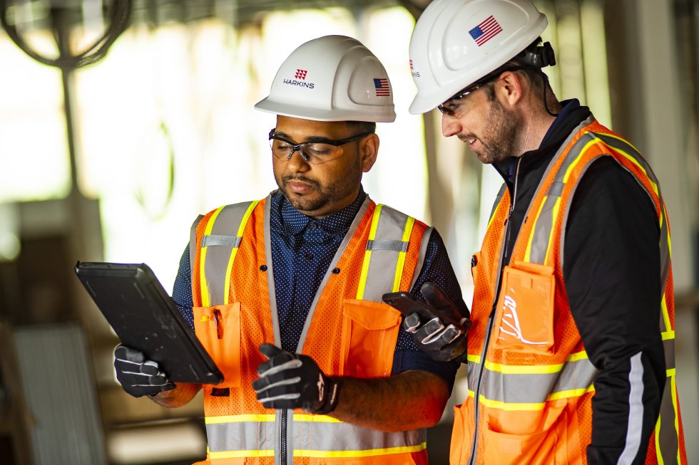 Harkins employees collaborating at a job site.